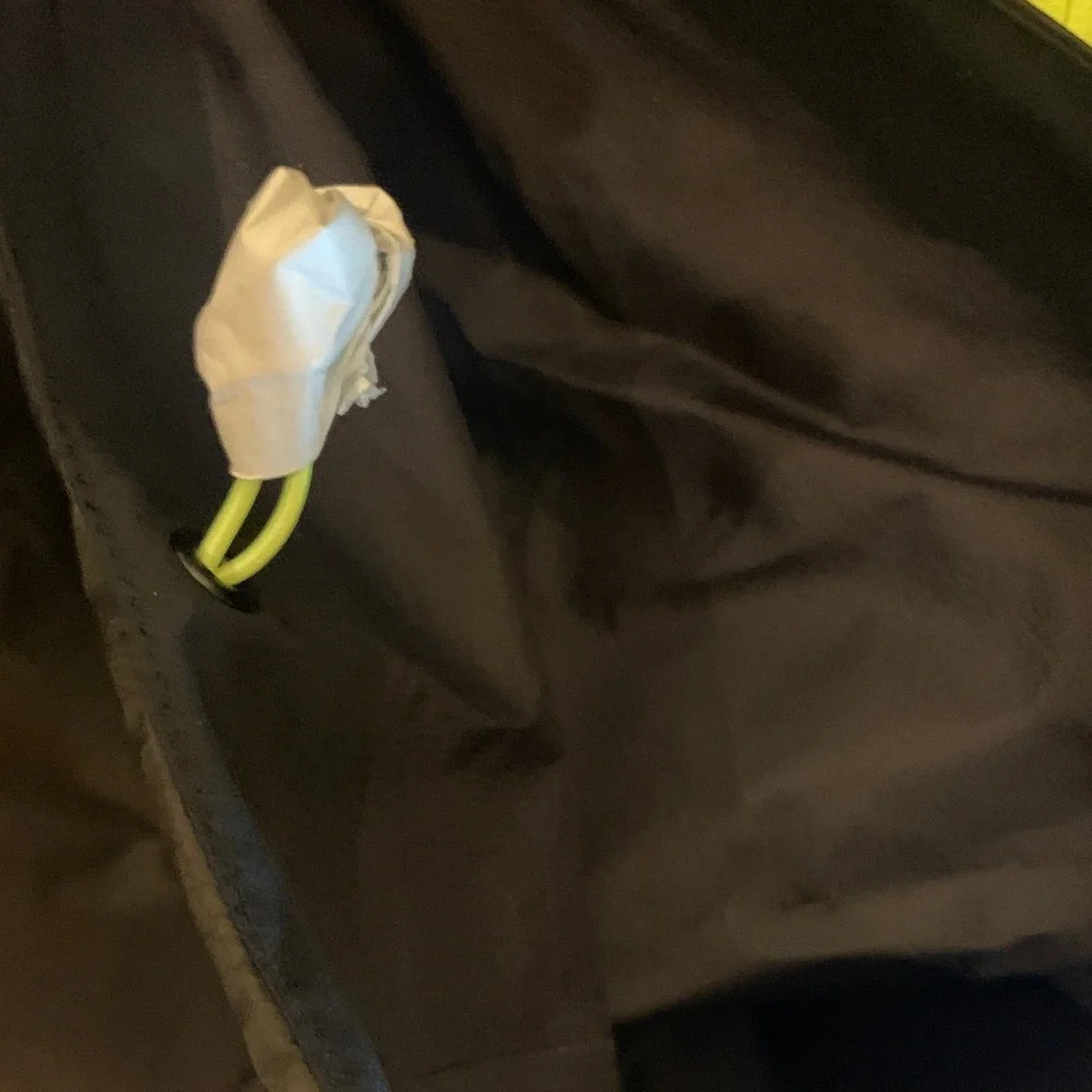 The North Face Men's Black Raincoat with Bright Yellow Zipper
